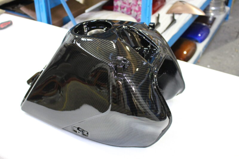 Motorbike tank coated in carbon fibre