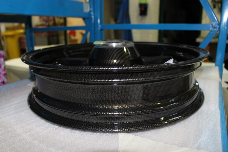 Motorbike wheels coated in carbon fibre