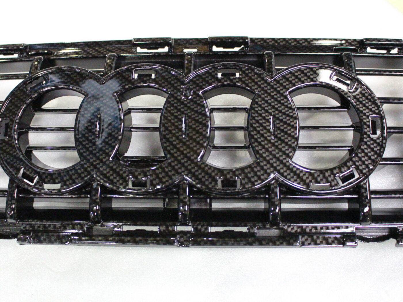Audi radiator cover coated in carbon fibre