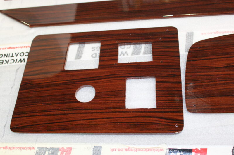Car Dashboard Elements Coated In Wood