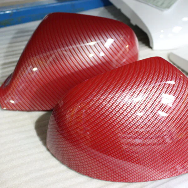 Car mirrors coated in carbon painted red