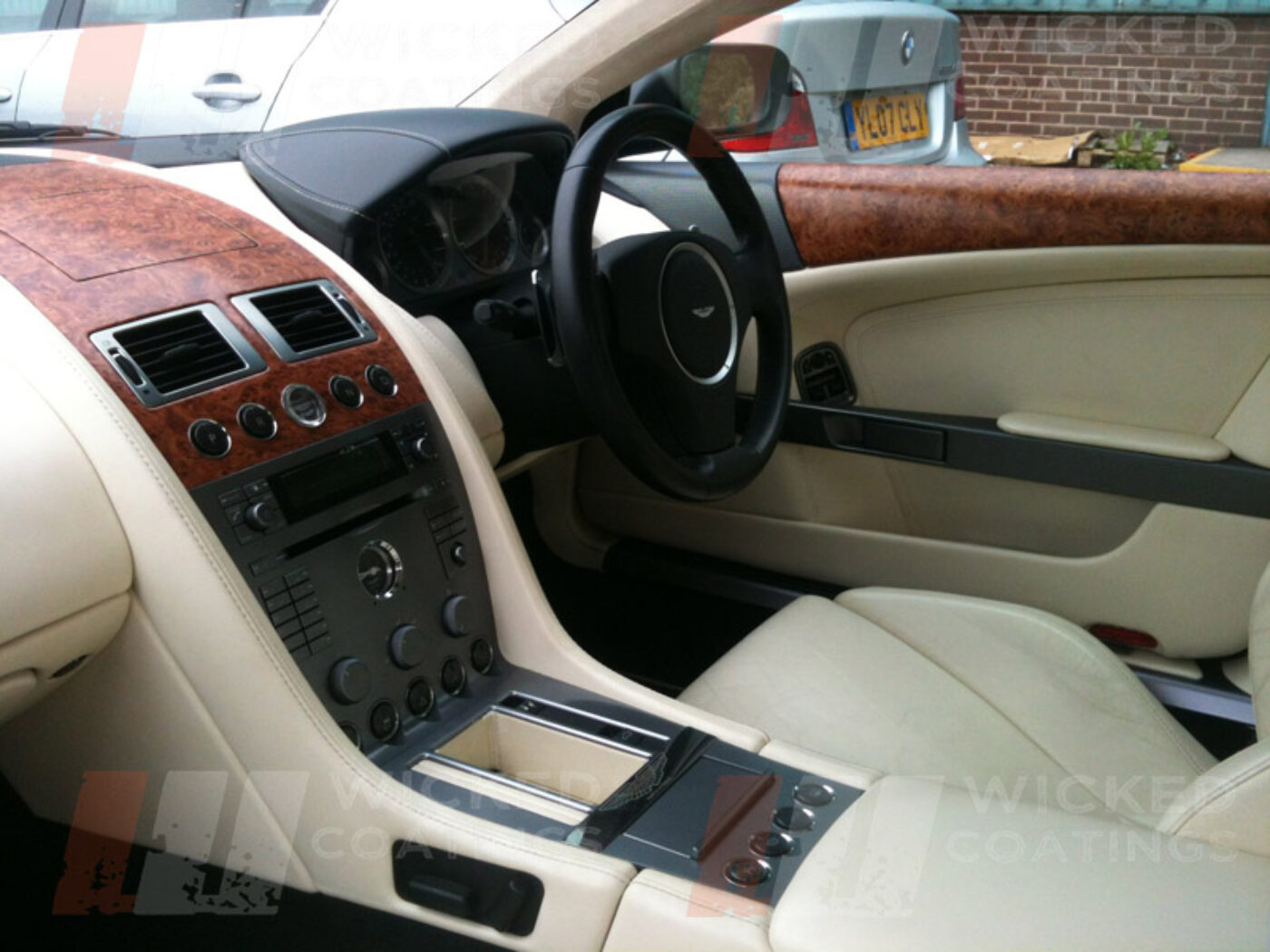Aston Martin parts of dashboard coated in wood