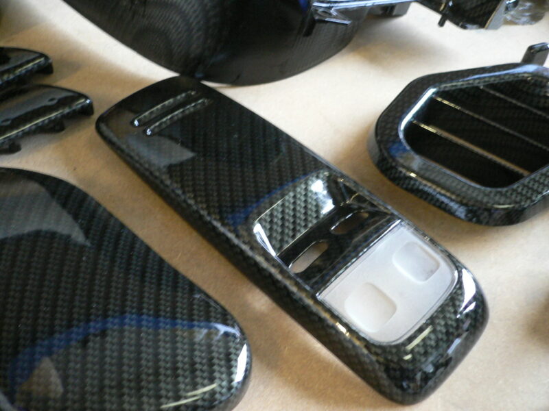 Car interior various elements coated in carbon fibre hydrographic film painted black