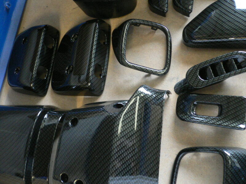 Car interior various elements coated in carbon fibre hydrographic film painted black
