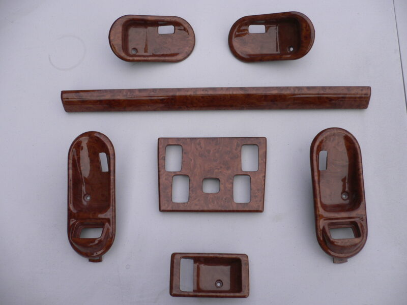 Various car interior elements coated in wood hydrographic film