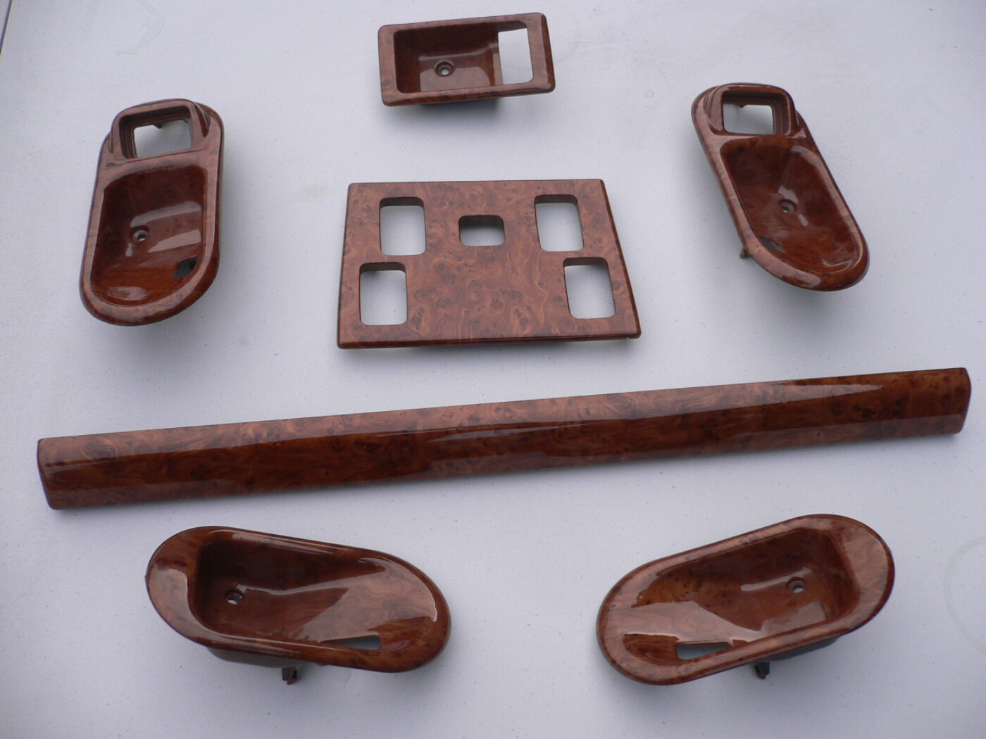 Various car interior elements coated in wood hydrographic film