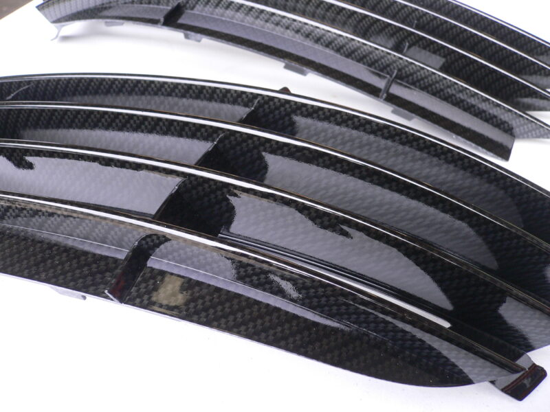 Car radiator cover coated in carbon fibre hydrographic film painted black