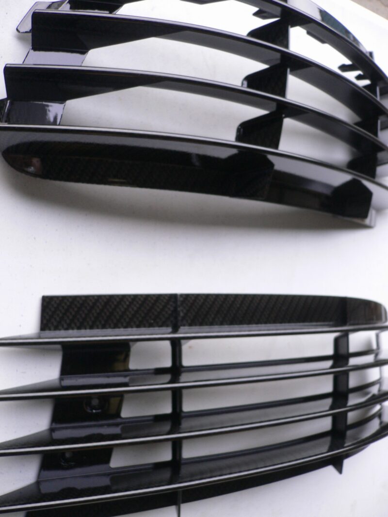 Car radiator cover coated in carbon fibre hydrographic film painted black