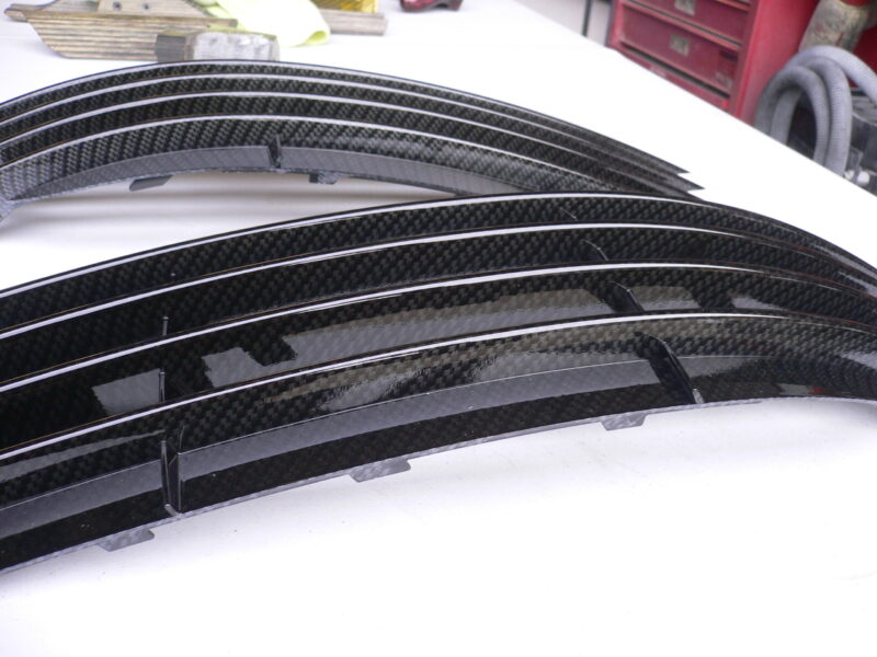 Car radiator cover coated in carbon fibre hydrographic film painted black