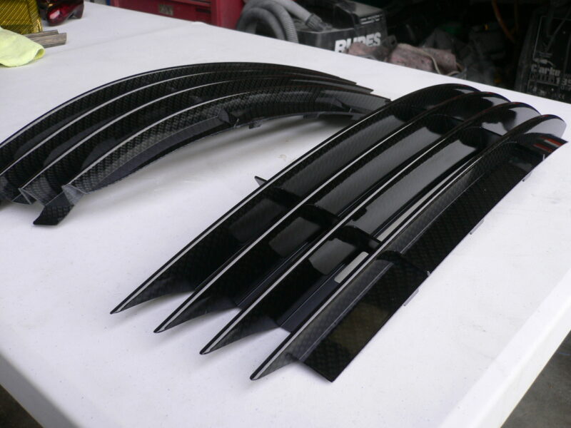 Car radiator cover coated in carbon fibre hydrographic film painted black