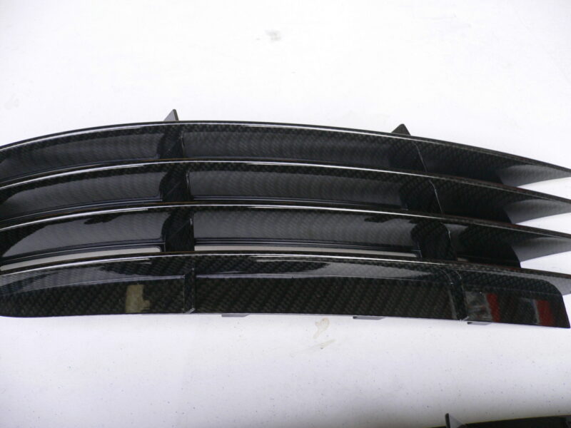 Car radiator cover coated in carbon fibre hydrographic film painted black