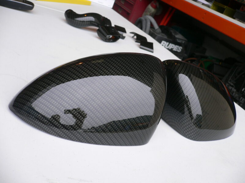 Car mirrors cover coated in carbon fibre hydrographic film painted black