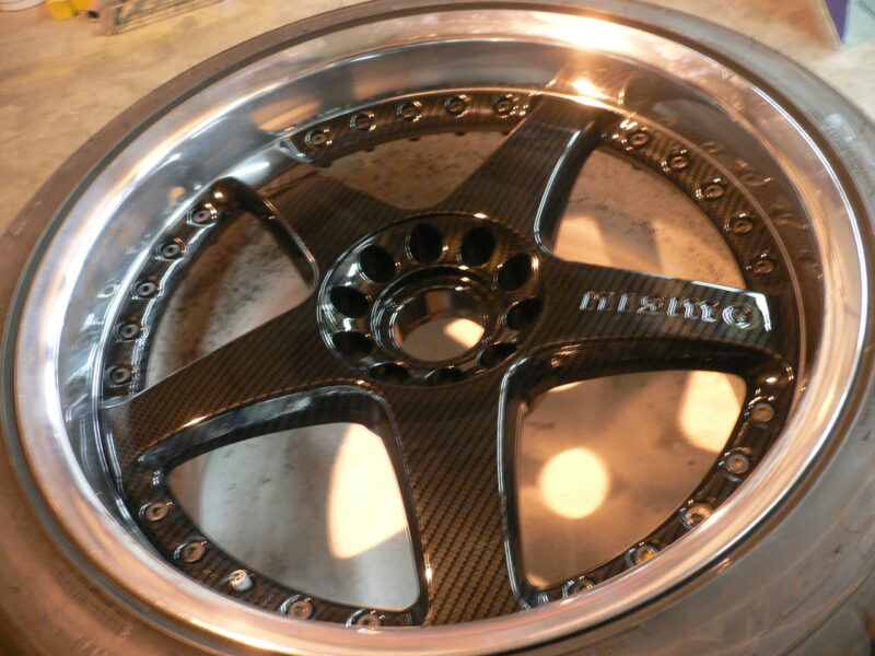 Nismo alloy wheels coated in carbon fibre