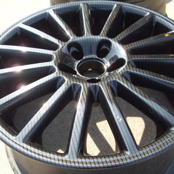 Car alloy wheels coated in carbon fibre