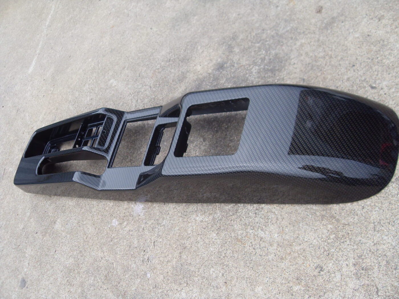 Car interior parts coated in carbon fibre hydrographic film painted black