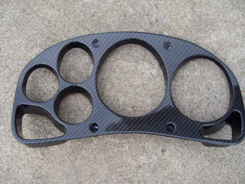 Car interior parts coated in carbon fibre hydrographic film painted black