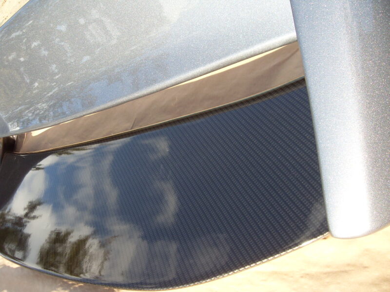 Car exterior parts coated in carbon fibre painted silver