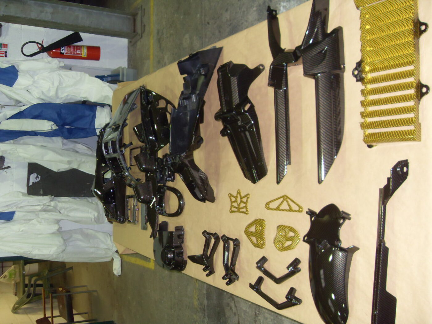 Motorbike various parts coated in carbon fibre hydrographic film painted black and yellow