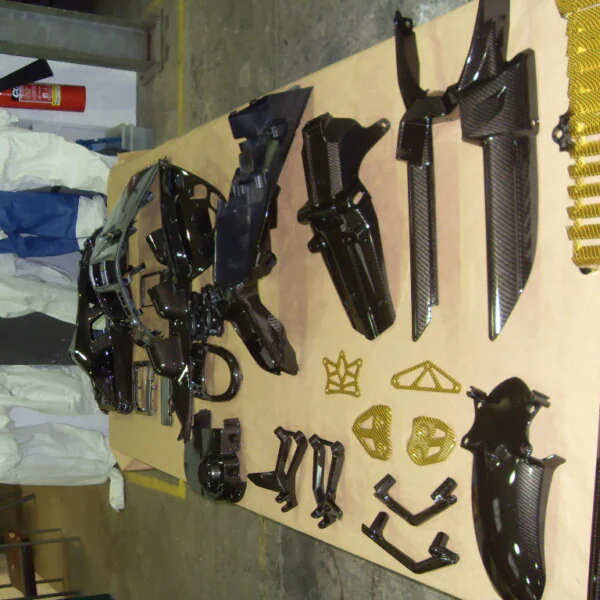 Motorbike various parts coated in carbon fibre hydrographic film painted black and yellow