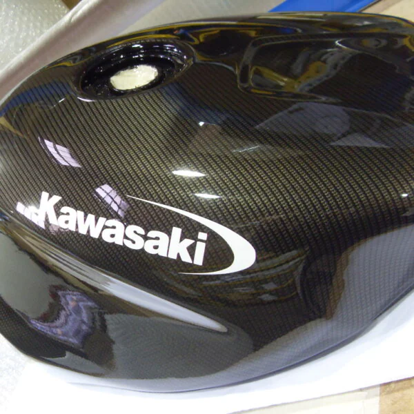 Motorbike tank coated in carbon fibre hydrographic film painted black