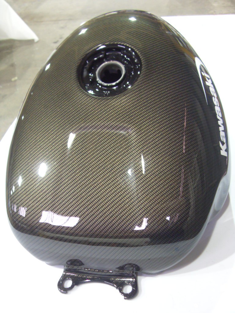 Motorbike tank coated in carbon fibre hydrographic film painted black
