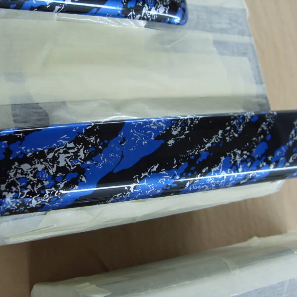 Random Items Coated In Blue Abstract Hydrographic Film.