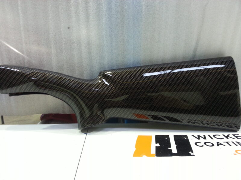 Gun elements coated in carbon fibre hydrographic film painted black
