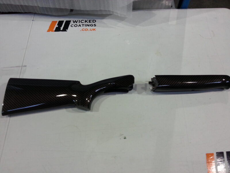 Gun elements coated in carbon fibre hydrographic film painted black