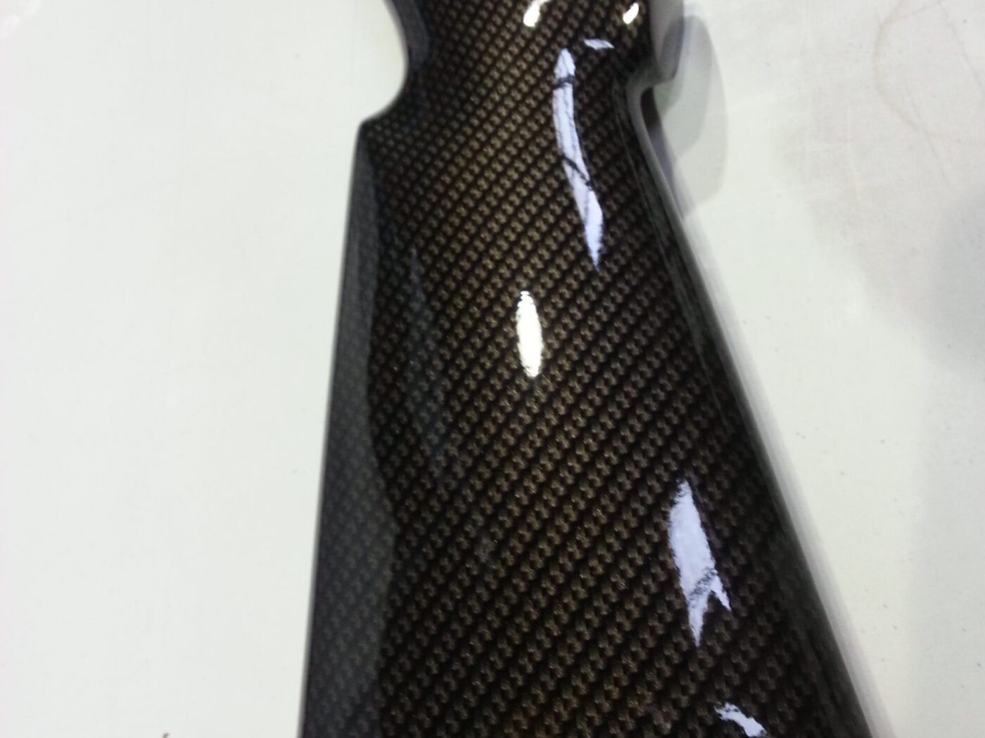 Gun elements coated in carbon fibre hydrographic film painted black