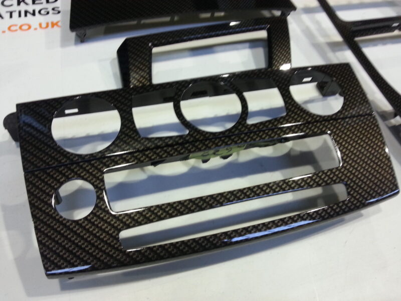 BMW interior various elements coated in carbon fibre hydrographic film painted black