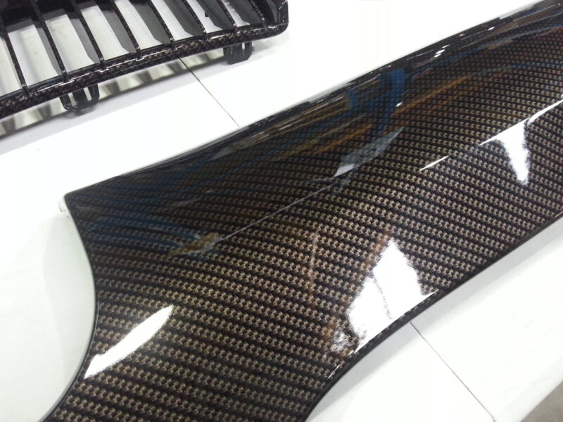 BMW exterior elements coated in carbon fibre hydrographic film painted black