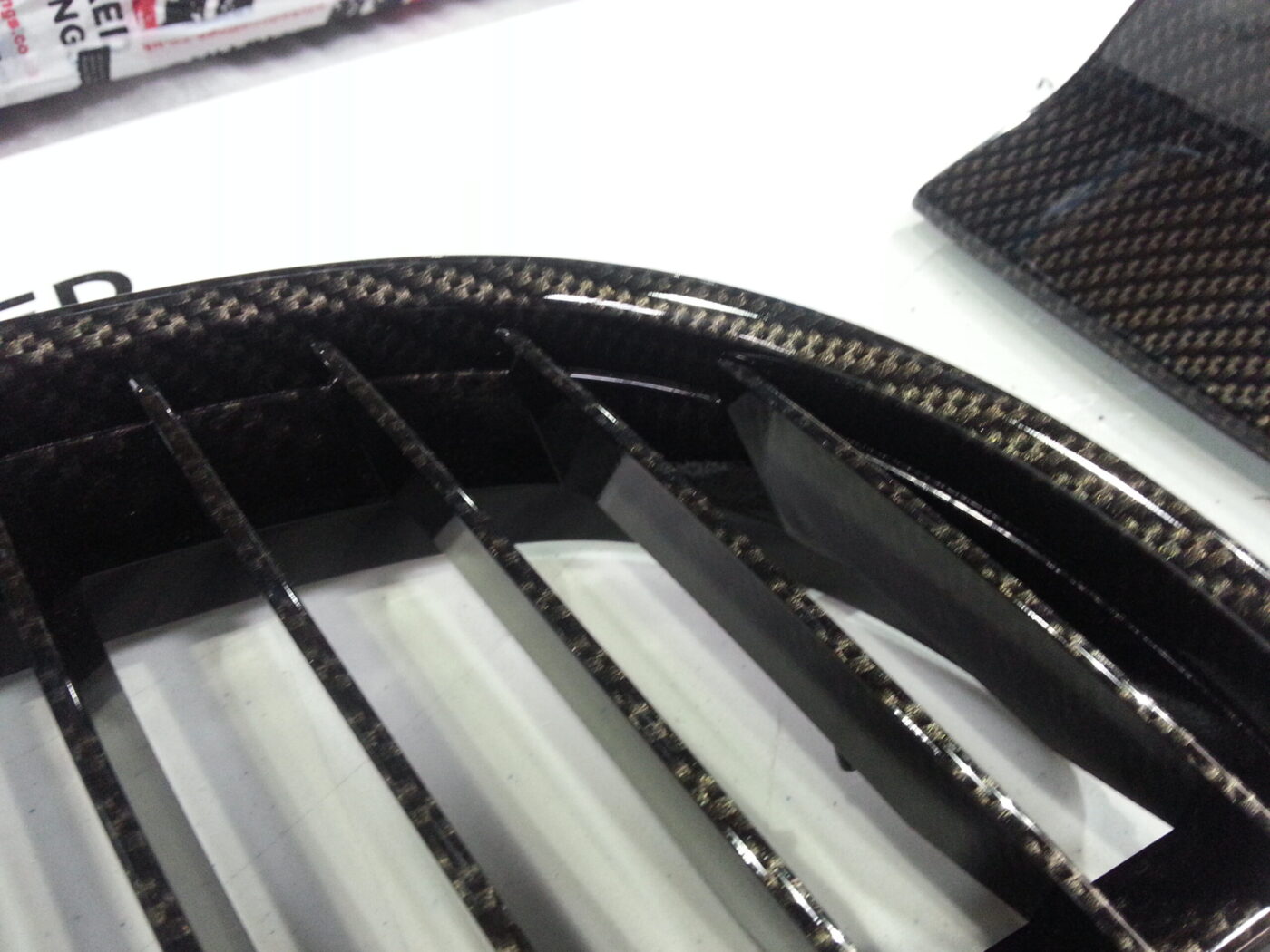 BMW exterior elements coated in carbon fibre hydrographic film painted black