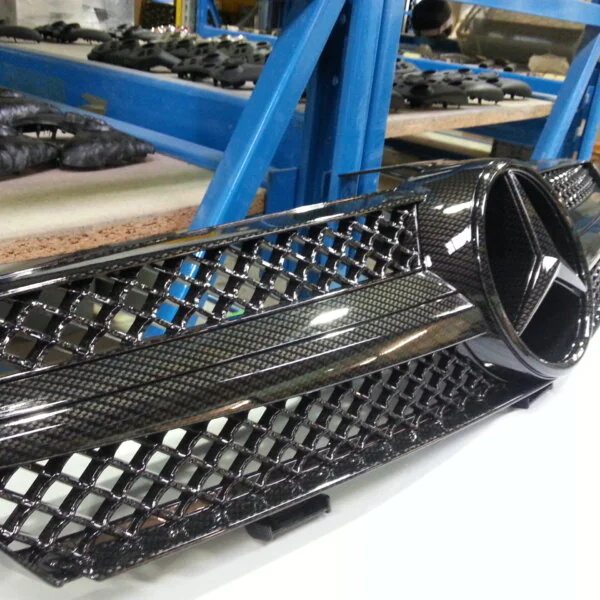 Mercedes radiator grill coated in carbon fibre hydrographic film painted black