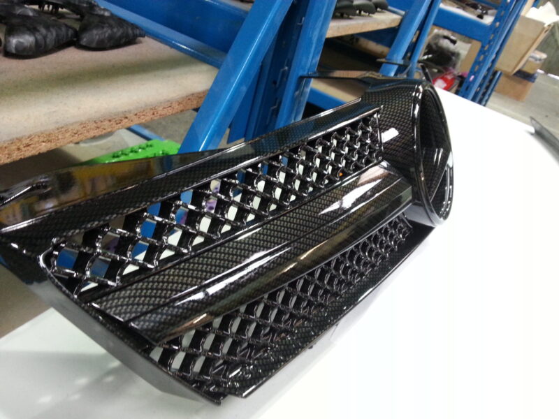 Mercedes radiator grill coated in carbon fibre hydrographic film painted black