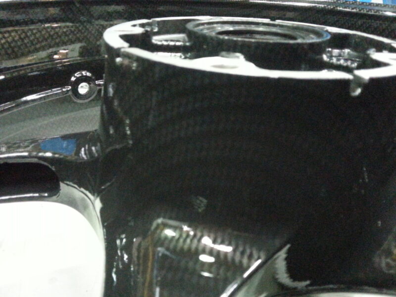 Motorbike alloy wheels coated in carbon fibre hydrographic film painted black