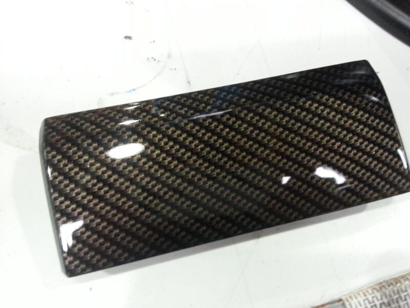 Car alloy wheels coated in carbon fibre hydrographic film painted black