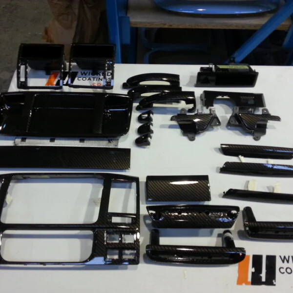 Car interior various elements coated in carbon fibre hydrographic film painted black