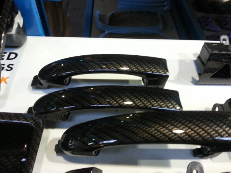Car interior various elements coated in carbon fibre hydrographic film painted black