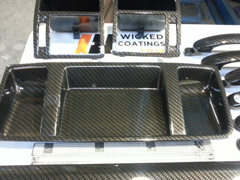 Car interior various elements coated in carbon fibre hydrographic film painted black