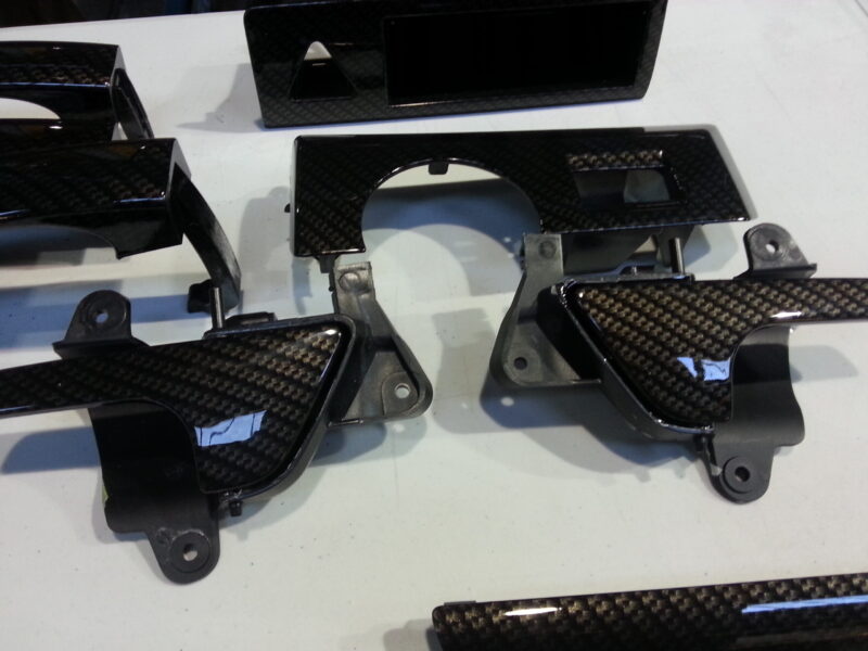 Car interior various elements coated in carbon fibre hydrographic film painted black