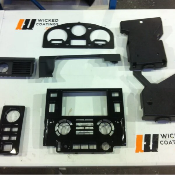 Parts of dashboard coated in carbon fibre