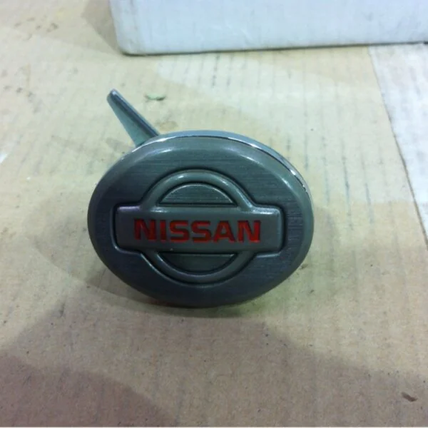 Nissan badge coated in carbon fibre