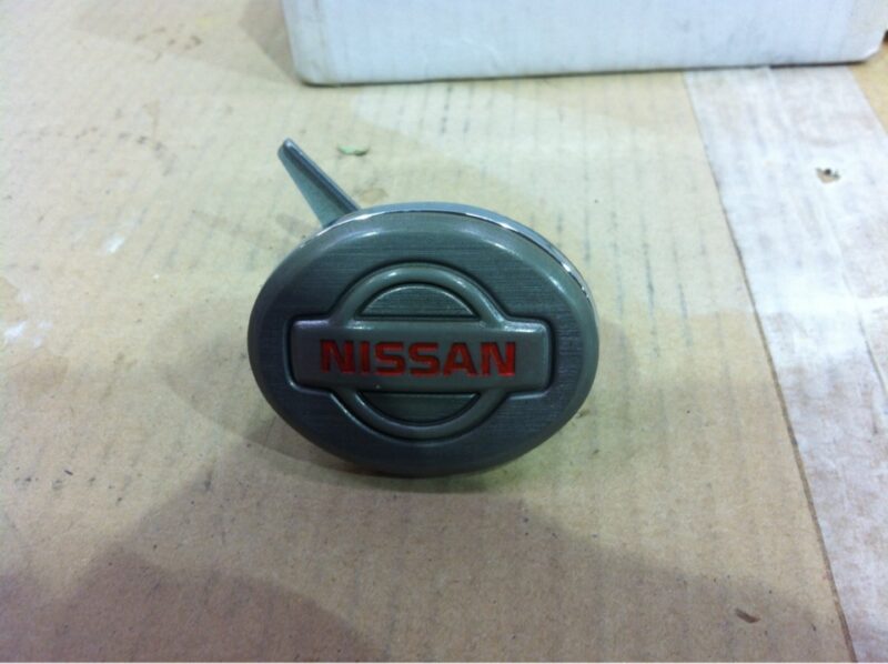 Nissan badge coated in carbon fibre