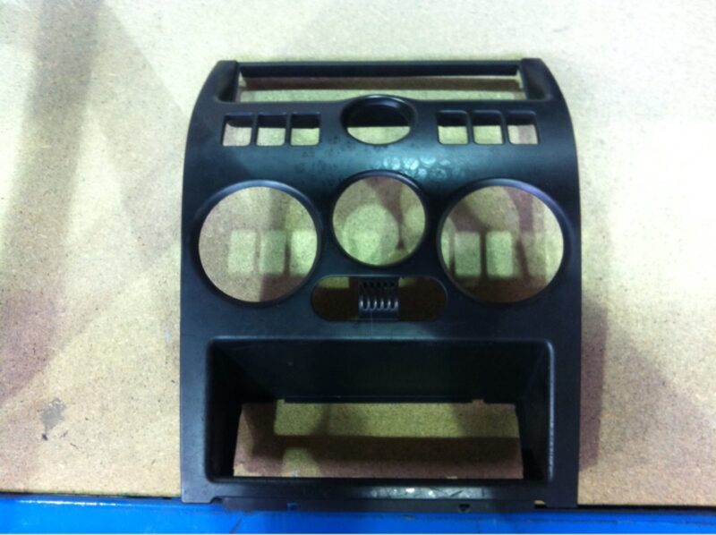 Parts of dashboard coated in carbon fibre