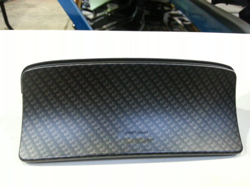 Car dashboard elements coat in carbon fibre hydrographic film painted black