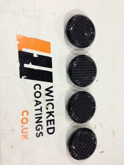 Car alloy wheels coated in carbon fibre hydrographic film painted grey