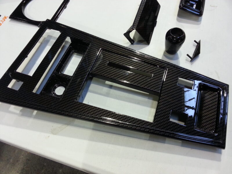 Car interior various elements coated in carbon fibre hydrographic film painted black