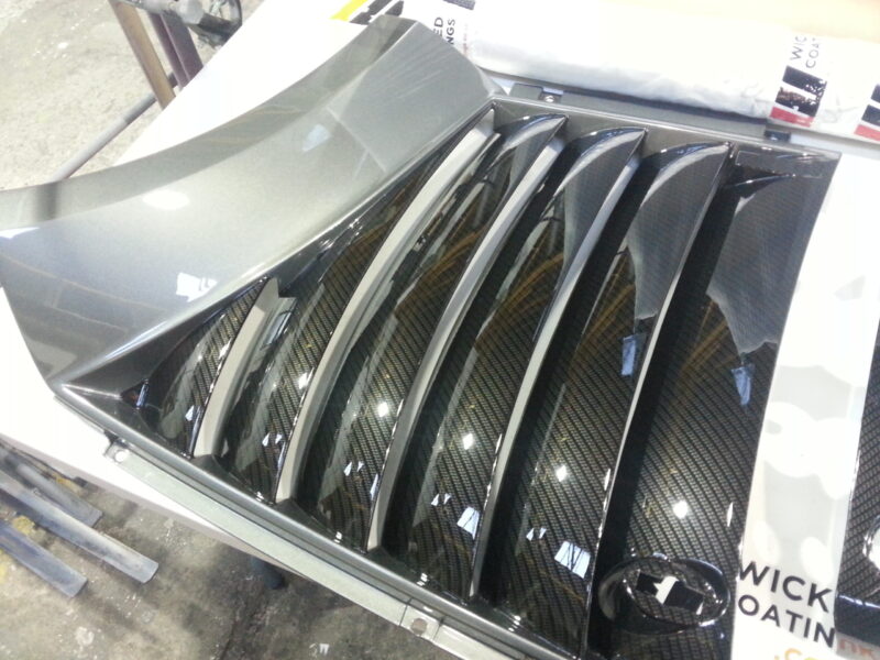 Car various elements coated in carbon fibre hydrographic film painted black