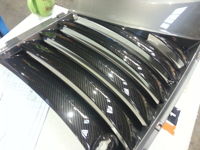 Car various elements coated in carbon fibre hydrographic film painted black