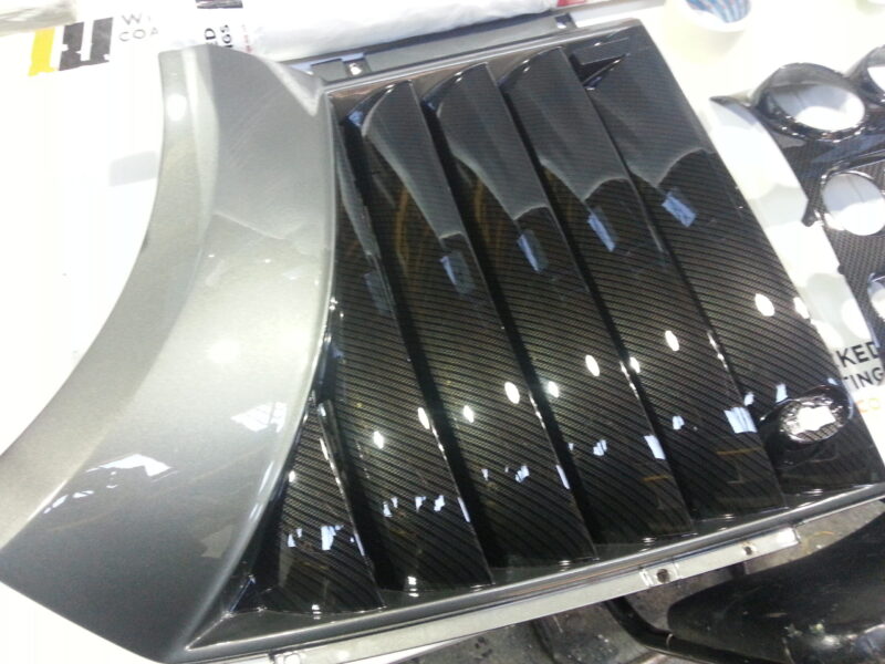 Car various elements coated in carbon fibre hydrographic film painted black